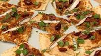 Flatbread with White Bean Hummus, Caramelized Onions, Black Olives and Spanish White Anchovies Flatbread with White Bean Hummus, Caramelized Onions, Black Olives and Spanish White Anchovies