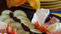 Meza (A plate of cucumbers, smoked meat, cheese, olives, tomatoes and hard boiled eggs) Meza (A plate of cucumbers, smoked meat, cheese, olives, tomatoes and hard boiled eggs)