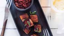 Bourbon-glazed pork belly with chorizo and roasted red pepper sauce Bourbon-glazed pork belly with chorizo and roasted red pepper sauce