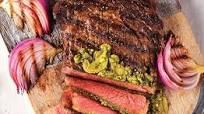 Ribeye Steaks with Grilled Red Onions, Sautéed Garlic Slices and Pesto Ribeye Steaks with Grilled Red Onions, Sautéed Garlic Slices and Pesto