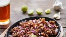 Pork Sisig (Charcoal Grilled, Served on a Sizzling Platter) Pork Sisig (Charcoal Grilled, Served on a Sizzling Platter)