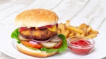Burger with breaded patties, cheese and crispy chips Burger with breaded patties, cheese and crispy chips