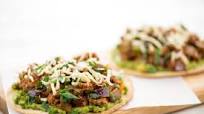 Pork Tinga Tostadas with guacamole and Chihuahua cheese