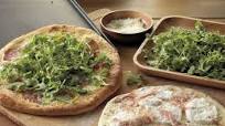 Pizzas with Prosciutto, Arugula, and Mozzarella Pizzas with Prosciutto, Arugula, and Mozzarella