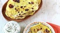 Naan Bread with Curry Butter, Yogurt Dip and Spicy Hummus Naan Bread with Curry Butter, Yogurt Dip and Spicy Hummus
