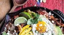 Carnitas Chilaquiles with Whipped Jalapeño Cream. Carnitas Chilaquiles with Whipped Jalapeño Cream.