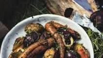 Ember-baked roots with garlic and carrot tops Ember-baked roots with garlic and carrot tops