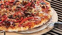 Barbecued pizza with sausage and capsicum Barbecued pizza with sausage and capsicum