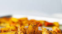 OVEN-BAKED POTATOES WITH JAMAICAN CURRY AND CARAWAY FRUITS OVEN-BAKED POTATOES WITH JAMAICAN CURRY AND CARAWAY FRUITS