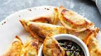 Sheet Pan Spicy Chicken Potstickers with Ginger Sauce Sheet Pan Spicy Chicken Potstickers with Ginger Sauce