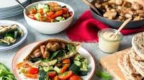 Mediterranean chicken pitas with hummus and tomato-cucumber salad Mediterranean chicken pitas with hummus and tomato-cucumber salad