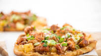 Hawaiian BBQ Chicken Thigh Pizza with pineapple and cheddar-jack cheese Hawaiian BBQ Chicken Thigh Pizza with pineapple and cheddar-jack cheese