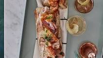 Roast pork belly sub with crackling, balsamic onions and apple sauce Roast pork belly sub with crackling, balsamic onions and apple sauce