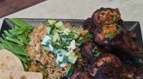Tikka Masala Drumsticks with pilaf rice cucumber and roti Tikka Masala Drumsticks with pilaf rice cucumber and roti