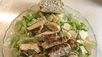 Caesar Salad with Iceberg Lettuce, Fried Turkey Breast Strips and Parmesan Caesar Salad with Iceberg Lettuce, Fried Turkey Breast Strips and Parmesan
