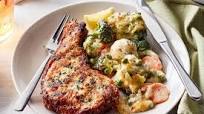 Crumbed pork chop with cheesy vegetables Crumbed pork chop with cheesy vegetables