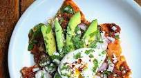 Barbacoa Chilaquiles With Avocado, Queso Fresco, And A Poached Egg. Barbacoa Chilaquiles With Avocado, Queso Fresco, And A Poached Egg.