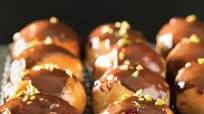 Cranberry and orange hot cross buns with milk chocolate drizzle Cranberry and orange hot cross buns with milk chocolate drizzle