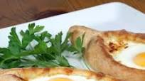 Adjaruli Khachapuri (Georgian Cheese Bread) Adjaruli Khachapuri (Georgian Cheese Bread)