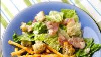 Eighties homemade thin chips with Caesar salad Eighties homemade thin chips with Caesar salad