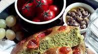 Green focaccia with cherry tomatoes and cheese Green focaccia with cherry tomatoes and cheese