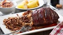 Pulled pork shoulder served with coleslaw and corn Pulled pork shoulder served with coleslaw and corn