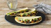 Smoky Black Bean and Caramelized Sweet Potato Tacos with Blistered Corn and Avocado-Lime Crema Smoky Black Bean and Caramelized Sweet Potato Tacos with Blistered Corn and Avocado-Lime Crema