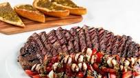 Seared Ribeye with Caprese Salad with pesto-garlic bread Seared Ribeye with Caprese Salad with pesto-garlic bread