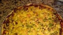 Homemade pizza with minced beef and cheese topping Homemade pizza with minced beef and cheese topping