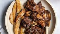 Jamaican Braised Oxtail With Buttered Spinners Jamaican Braised Oxtail With Buttered Spinners