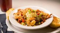 The Real New Orleans Style Restaurant's Shrimp and Grits The Real New Orleans Style Restaurant's Shrimp and Grits