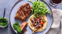 Black Angus steaks with chermoula, maitake mushrooms, and hummus Black Angus steaks with chermoula, maitake mushrooms, and hummus