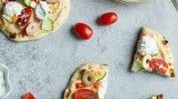 Veggie-Loaded Flatbread Pizza with Hummus and Tzatziki Veggie-Loaded Flatbread Pizza with Hummus and Tzatziki