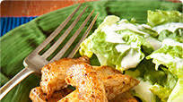 Jerk chicken strips with a Caesar salad dressing Jerk chicken strips with a Caesar salad dressing