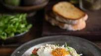 Hummus toast with poached egg, avo, feta, tomatoes, rocket & za’atar Hummus toast with poached egg, avo, feta, tomatoes, rocket & za’atar