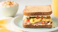 Breakfast Sandwich with Hummus, Scrambled Eggs and Tomato Breakfast Sandwich with Hummus, Scrambled Eggs and Tomato