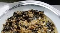 Filipino dish with taro leaves in coconut milk Filipino dish with taro leaves in coconut milk