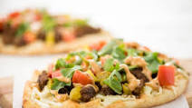 Cheeseburger Flatbread with pickles, mozzarella, and arugula Cheeseburger Flatbread with pickles, mozzarella, and arugula