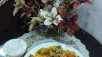 Mutton biryani with boondi and onion cucumber raita Mutton biryani with boondi and onion cucumber raita