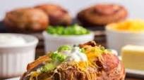 Loaded Baked Potatoes Wrapped in Bacon Loaded Baked Potatoes Wrapped in Bacon