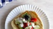 Greek Salad On Homemade Baked Sesame Oil Pita Bread With Tzatziki Sauce Greek Salad On Homemade Baked Sesame Oil Pita Bread With Tzatziki Sauce
