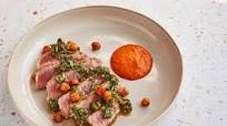 Iberico pork presa with chimichurri and red pepper purée Iberico pork presa with chimichurri and red pepper purée