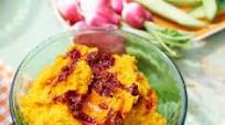 Carrot & cumin hummus with swirled harissa Carrot & cumin hummus with swirled harissa
