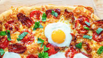 Breakfast Pizza with Cheddar, Bacon, and Eggs Breakfast Pizza with Cheddar, Bacon, and Eggs