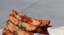 Baked Garlic Parmesan Potato Wedges Recipe by Tasty Baked Garlic Parmesan Potato Wedges Recipe by Tasty