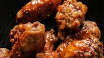 spicy pan fried chicken wings in teriyaki sauce. spicy pan fried chicken wings in teriyaki sauce.