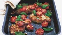Roast pork steaks with tomatoes and pine nuts Roast pork steaks with tomatoes and pine nuts