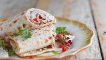 Persian Spiced Lamb Neck Fillets with Pomegranate, Spiced Yogurt and Tortilla Wraps -Recipe courtesy of Sabrina Ghayour Persian Spiced Lamb Neck Fillets with Pomegranate, Spiced Yogurt and Tortilla Wraps -Recipe courtesy of Sabrina Ghayour