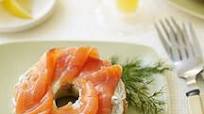 Bagel spread with smoked salmon and dill cream cheese Bagel spread with smoked salmon and dill cream cheese