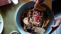 Slow-roasted lamb shoulder with pistachios, pomegranate and vine leaves Slow-roasted lamb shoulder with pistachios, pomegranate and vine leaves